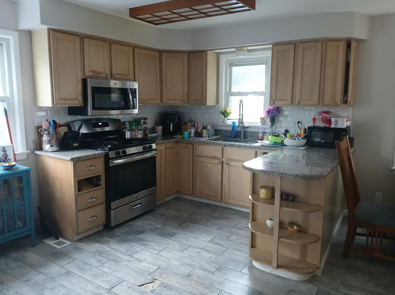 Kitchen after cleaning - organized with clear countertops and everything in place