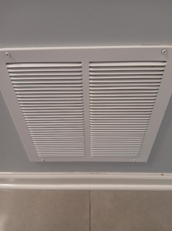 Air vent after cleaning - dusty and discolored with buildup on slats